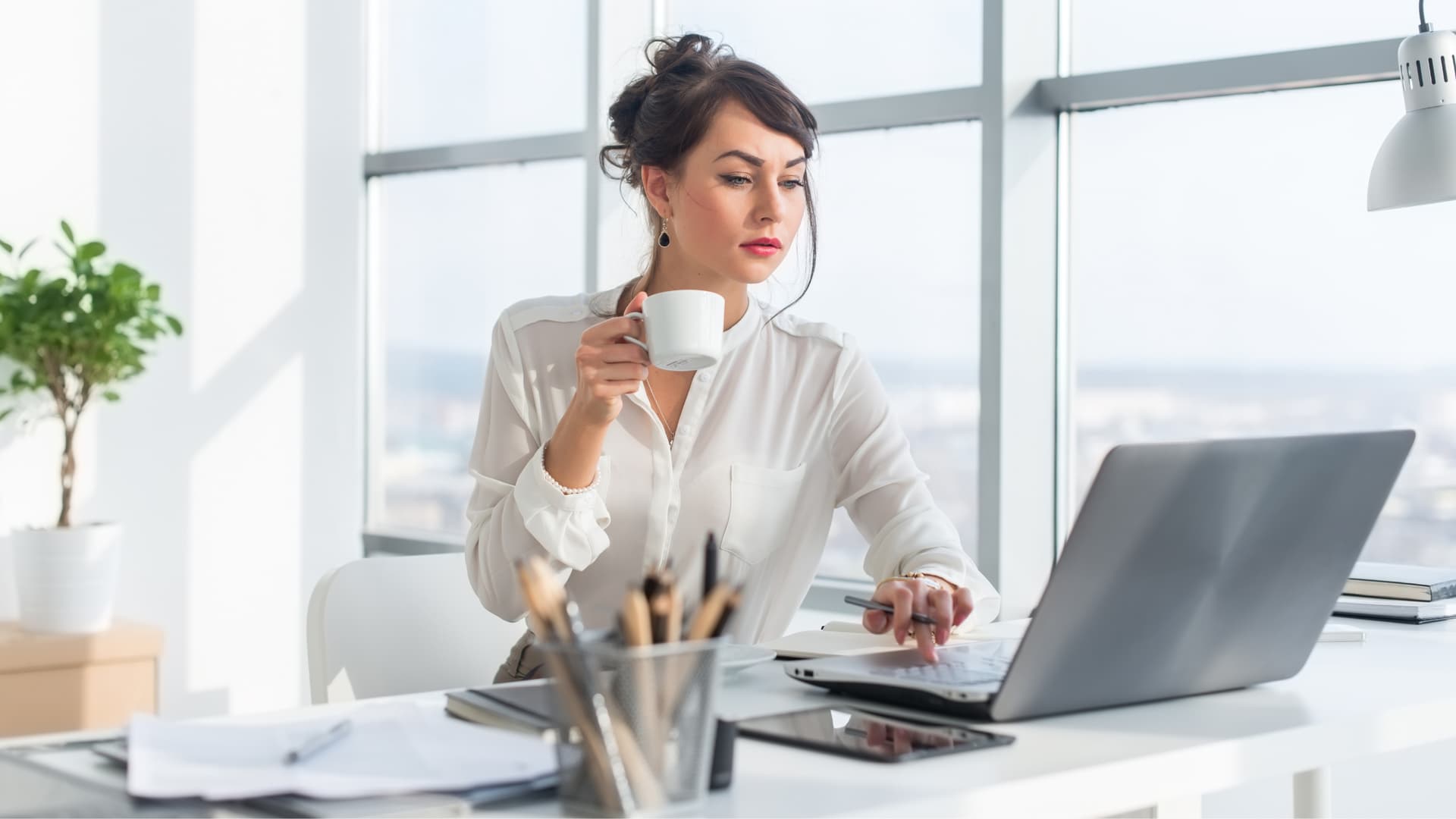Woman at laptop, blocking emails