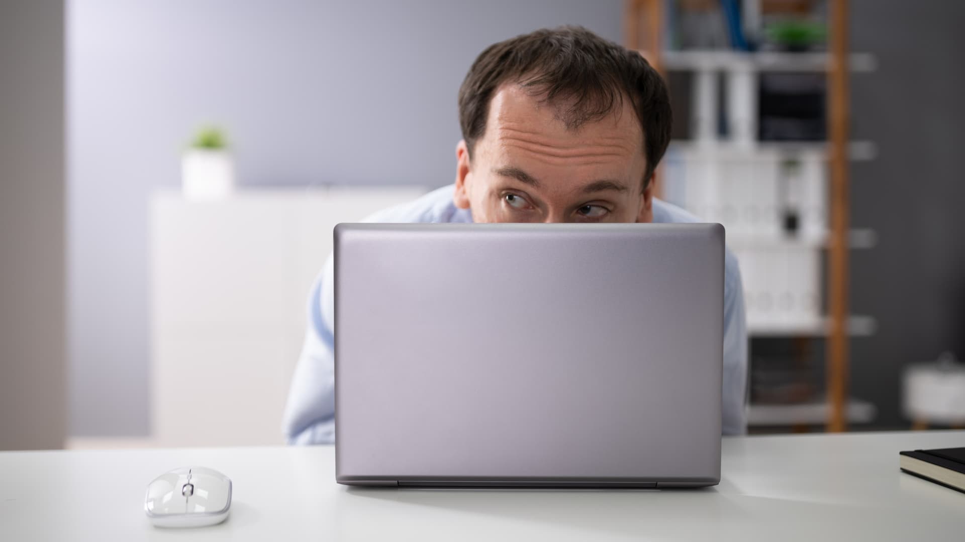 Man at laptop creating an alias in Gmail