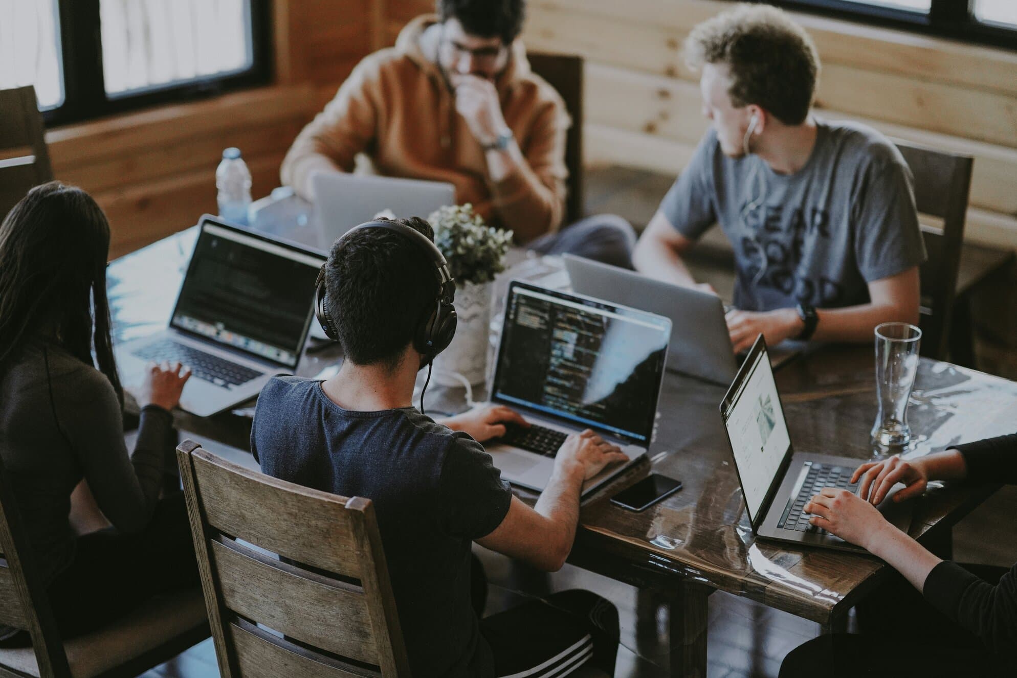 Employees working around a table together