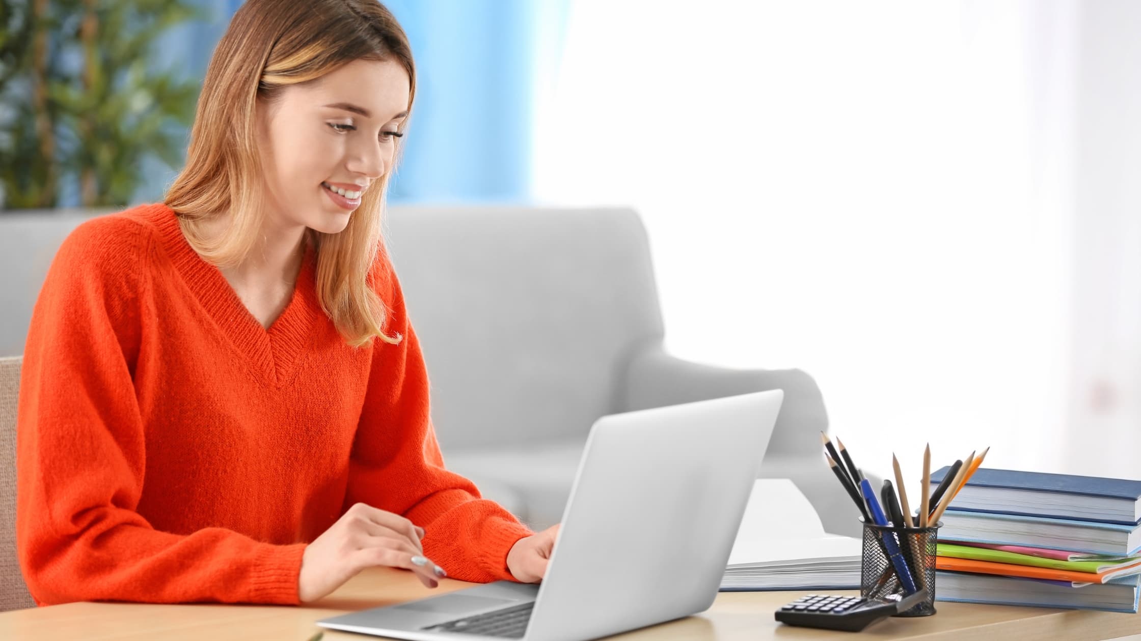 Woman at laptop, whitelisting emails